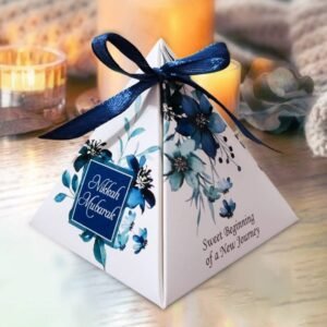 Triangle box 19 These beautifully crafted bid box favor boxes are designed to add a special touch to any event. From elegant gold boxes with satin ribbons perfect for weddings, to rustic kraft paper designs ideal for garden parties and birthdays, each box offers a unique charm. Our collection includes heart-shaped red favor boxes for romantic occasions, floral-print options for baby showers, and clear plastic boxes filled with colorful sweets for festive celebrations. Whether you're planning a bridal shower, corporate event, or birthday party, our customizable and eco-friendly favor boxes provide the perfect finishing detail to your celebration.