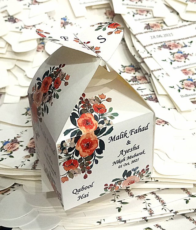 Heart bid box 002 These beautifully crafted bid box favor boxes are designed to add a special touch to any event. From elegant gold boxes with satin ribbons perfect for weddings, to rustic kraft paper designs ideal for garden parties and birthdays, each box offers a unique charm. Our collection includes heart-shaped red favor boxes for romantic occasions, floral-print options for baby showers, and clear plastic boxes filled with colorful sweets for festive celebrations. Whether you're planning a bridal shower, corporate event, or birthday party, our customizable and eco-friendly favor boxes provide the perfect finishing detail to your celebration.